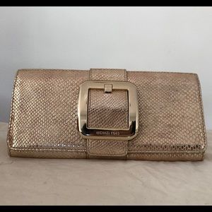 Brand new, never used gold Michael Kors clutch bag/wallet